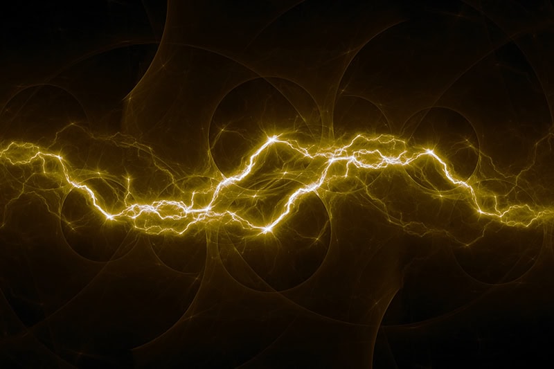 Buyer’s Guide to Voltage Monitors. Golden fractal lightning background, electrical abstract.